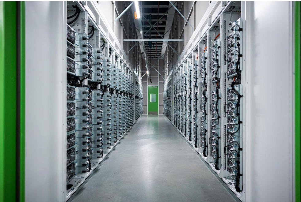 Rows of server racks in a data center hallway